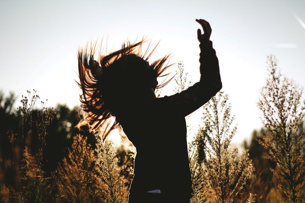 silhouette-of-person-surrounded-by-plants