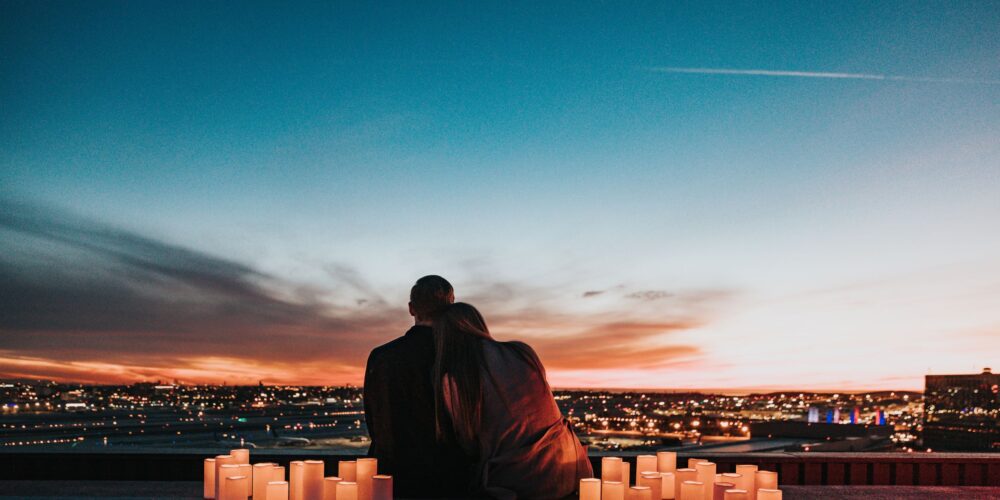 a couple looking at the sunset