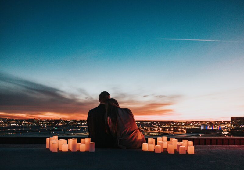 a couple looking at the sunset