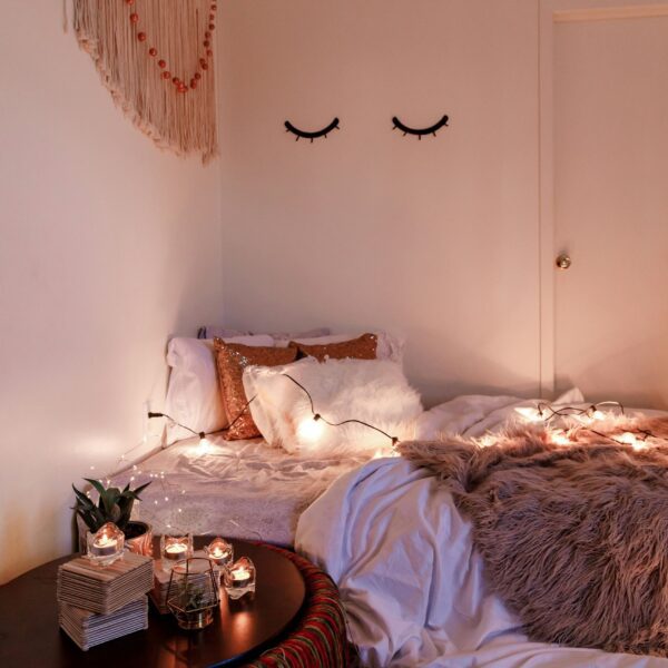 a cozy setup of bed with pillows and comforter