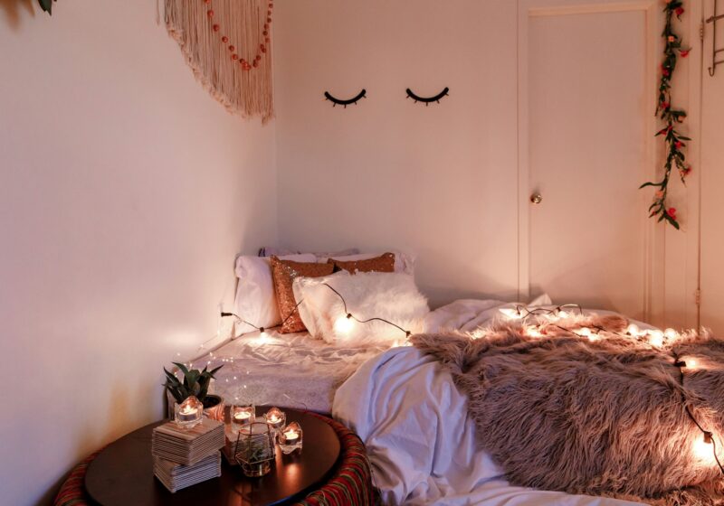 a cozy setup of bed with pillows and comforter