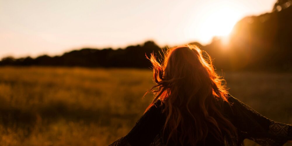 A girl looking at silver linings through the sky