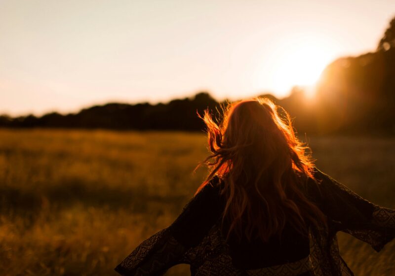 A girl looking at silver linings through the sky