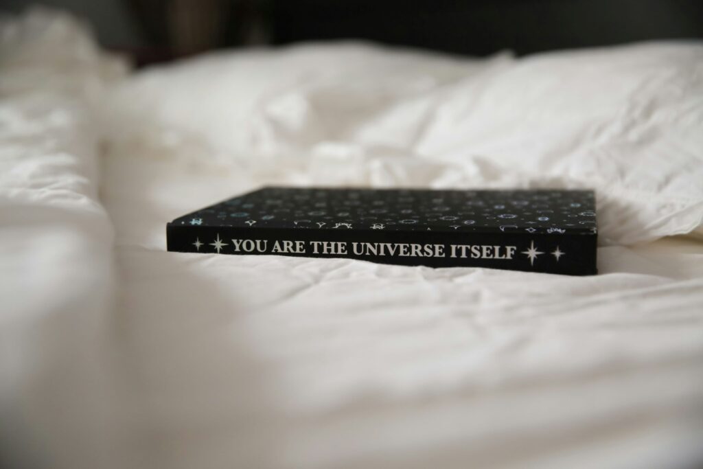 a manifestation journal on the bed