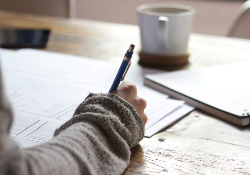 a women writing health journal