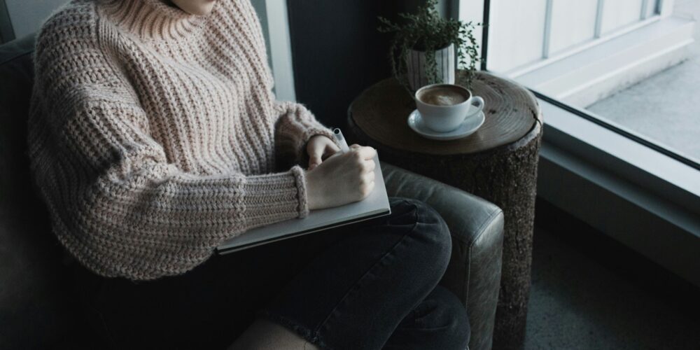 a women journaling for overthinking