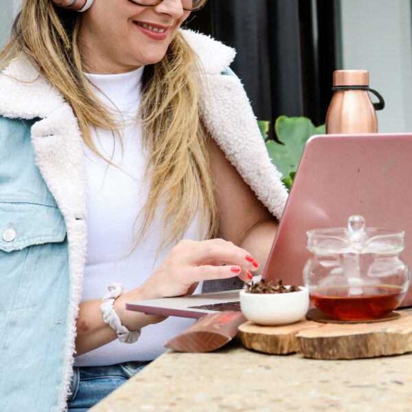 a confident woman working on her laptop