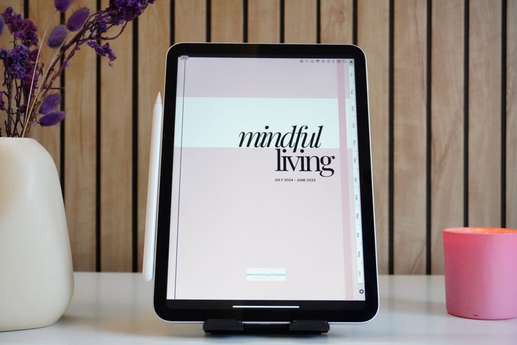 An iPad showing the cover of the Mindful Living Digital Planner, a journal designed for self-care, mindfulness, and goal-setting.