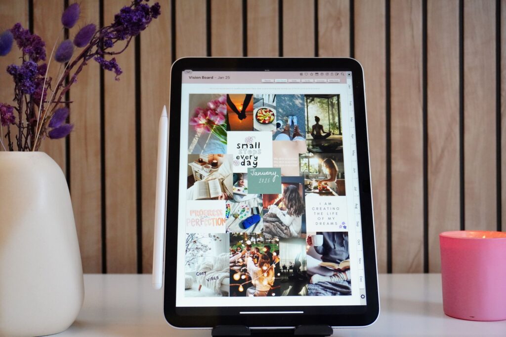 An iPad with the Vision Board page open in the Mindful Living Digital Planner, a space to set goals, stay mindful, and focus on self-care.