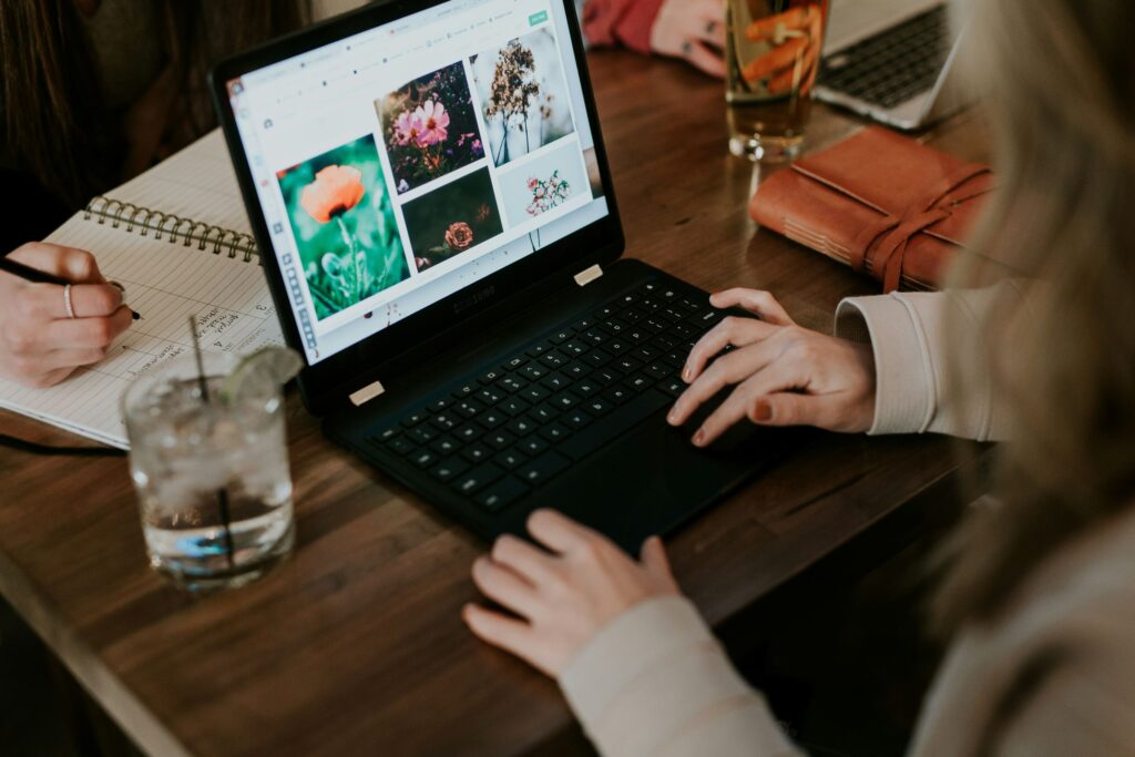 A woman is seen working calmly on her laptop in a peaceful setting. This image highlights mindfulness techniques at the workplace, helping reduce stress and improve focus.