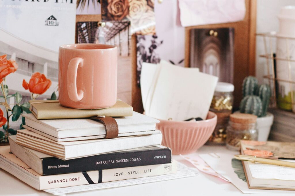 A cozy desk setup with an open notebook, pen, and a soft light, representing the habit of journaling and its benefits for mental clarity and memory retention.