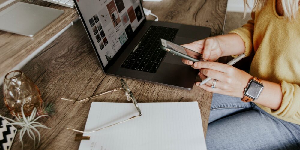 A woman working on her laptop, representing the daily hustle and the need for work-life balance in a modern professional's life.