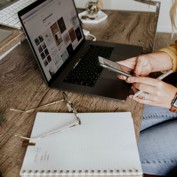 A woman working on her laptop, representing the daily hustle and the need for work-life balance in a modern professional's life.