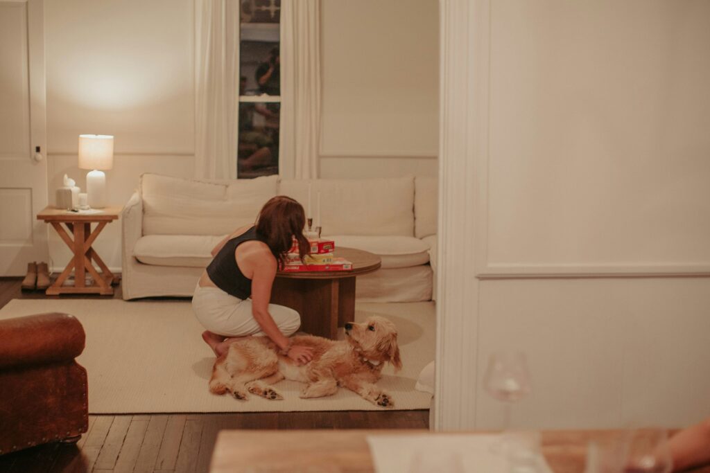 A girl playing with her dog after a long and hectic day at work