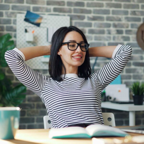 A girl happily working at office
